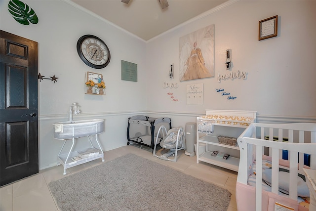 tiled bedroom with a crib and ornamental molding