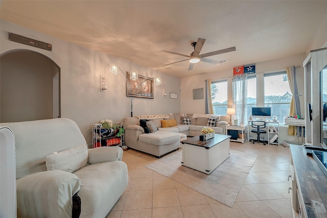 tiled living room featuring ceiling fan