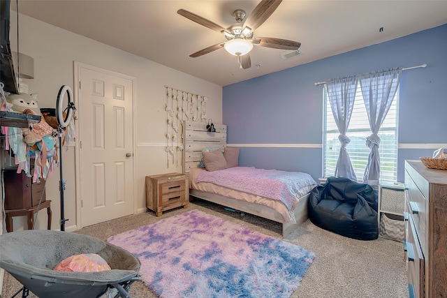 bedroom with ceiling fan and carpet floors