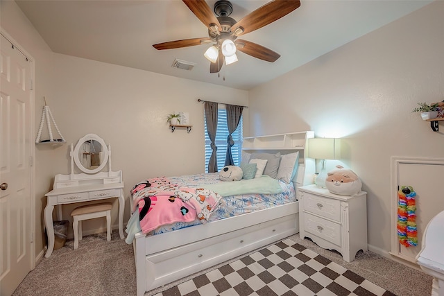 carpeted bedroom with ceiling fan