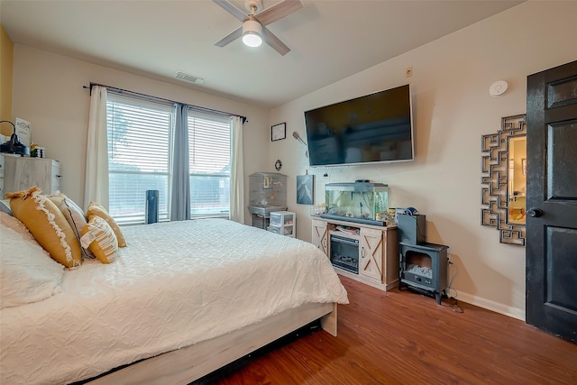 bedroom with ceiling fan and wood-type flooring