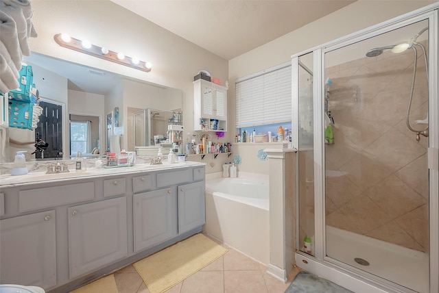 bathroom featuring tile patterned flooring, vanity, and independent shower and bath