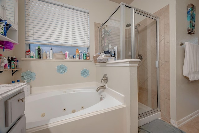 bathroom featuring plus walk in shower and vanity