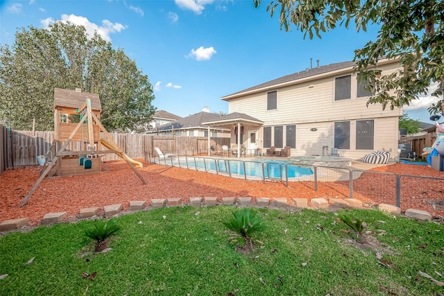 view of pool featuring a patio and a playground