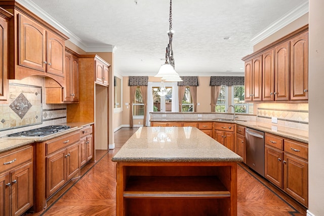 kitchen with parquet flooring, pendant lighting, a center island, light stone counters, and stainless steel appliances