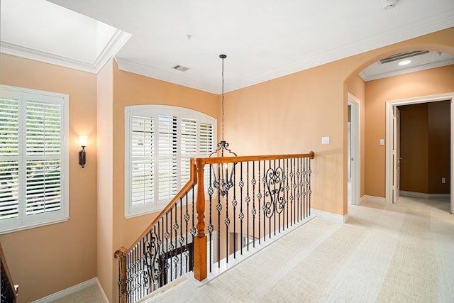 hall featuring ornamental molding