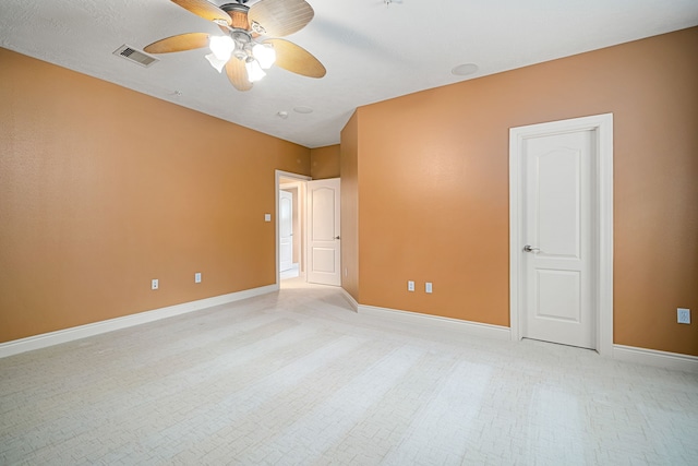 spare room with ceiling fan