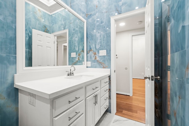 bathroom featuring vanity and ornamental molding