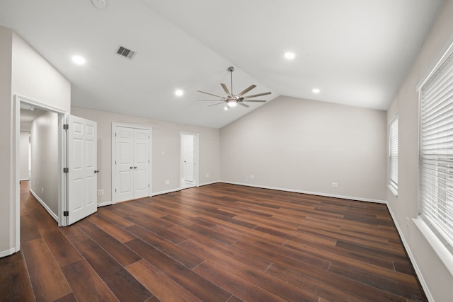 interior space with vaulted ceiling, ceiling fan, and dark hardwood / wood-style floors