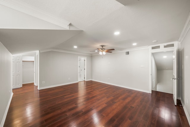 bonus room featuring a textured ceiling, dark hardwood / wood-style flooring, and ceiling fan