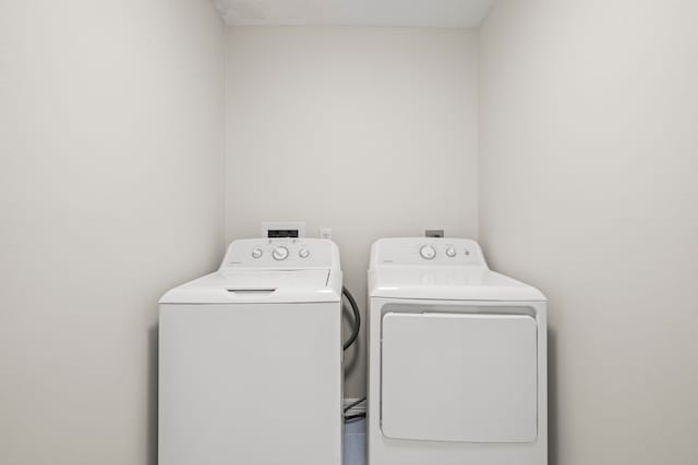 washroom featuring independent washer and dryer