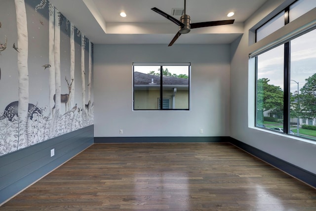 unfurnished room featuring dark hardwood / wood-style floors and ceiling fan