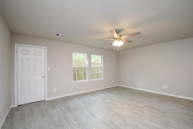 unfurnished room featuring light hardwood / wood-style floors and ceiling fan