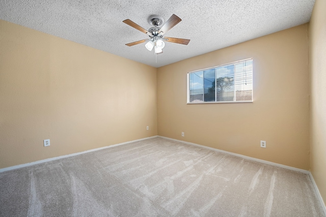 empty room with light carpet, a textured ceiling, and ceiling fan