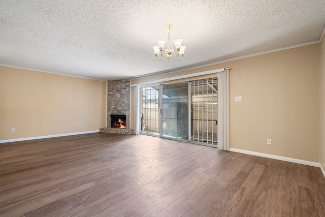 unfurnished living room with a textured ceiling, wood-type flooring, and a fireplace