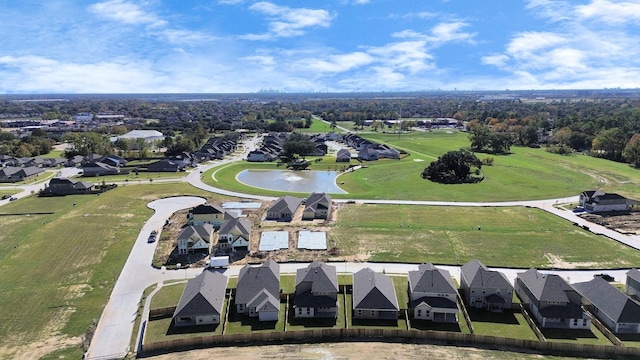 birds eye view of property with a residential view and a water view
