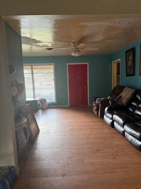 living room with hardwood / wood-style flooring and ceiling fan