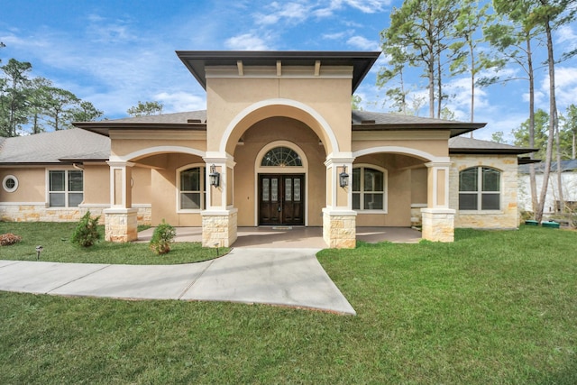 view of front facade with french doors and a front yard