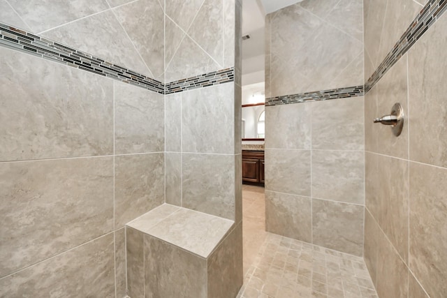 bathroom with tiled shower