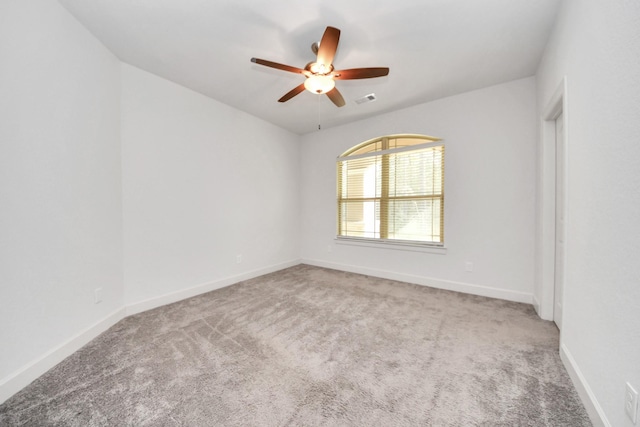 empty room with carpet floors and ceiling fan