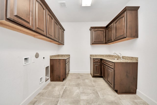 laundry room featuring sink, hookup for a washing machine, cabinets, hookup for an electric dryer, and gas dryer hookup