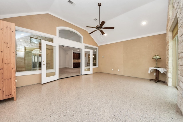 interior space featuring lofted ceiling, ceiling fan, and french doors