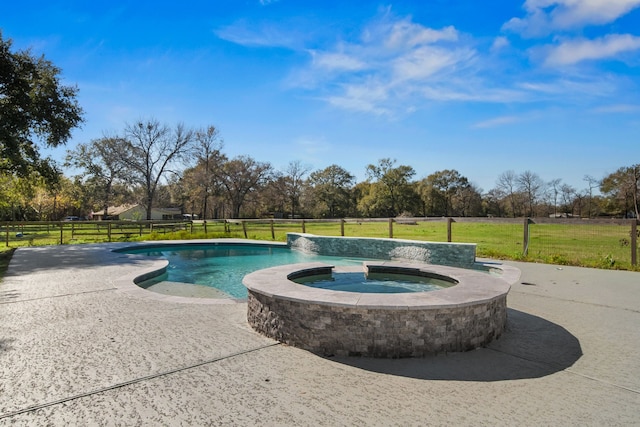 view of swimming pool with an in ground hot tub, a yard, and a patio