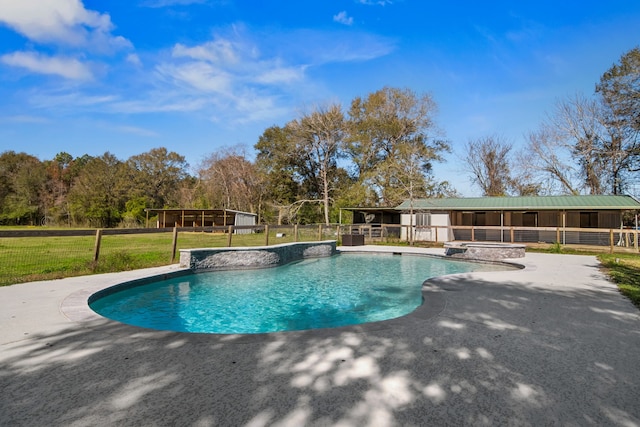 view of swimming pool featuring an in ground hot tub and a lawn