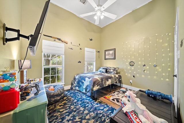 bedroom with ceiling fan and hardwood / wood-style floors