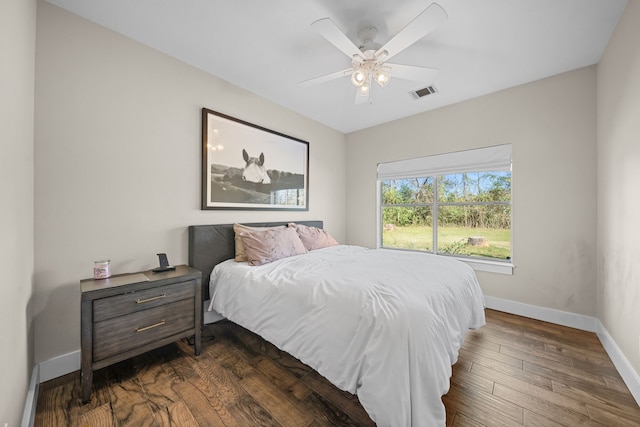 bedroom featuring ceiling fan and dark wood-type flooring