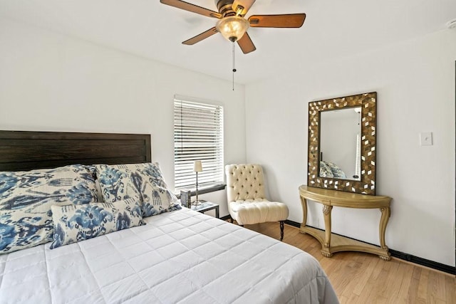 bedroom featuring light hardwood / wood-style floors and ceiling fan