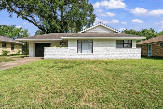 ranch-style house with a garage and a front lawn