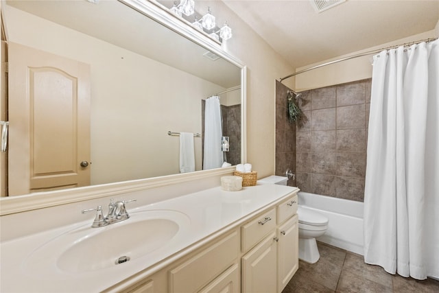 full bathroom with tile patterned floors, vanity, toilet, and shower / tub combo