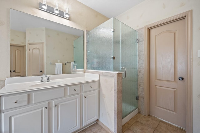 bathroom with walk in shower, tile patterned floors, and vanity