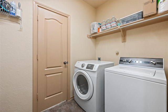 clothes washing area featuring washer and dryer