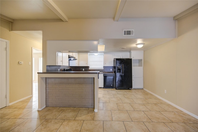 kitchen with white cabinets, beamed ceiling, kitchen peninsula, light tile patterned flooring, and black appliances