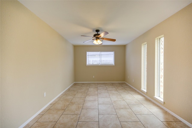 tiled empty room with ceiling fan