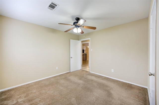 empty room featuring light colored carpet