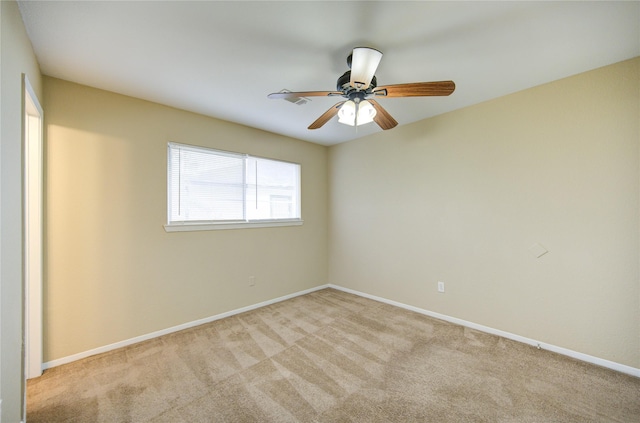 unfurnished room featuring light colored carpet