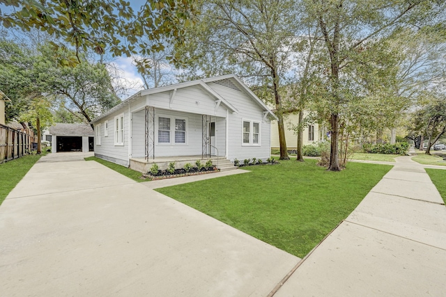 view of front facade featuring an outbuilding and a front lawn