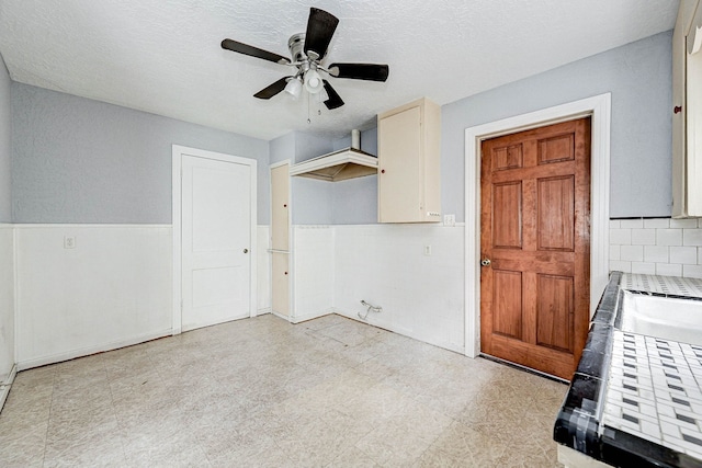 interior space featuring ceiling fan