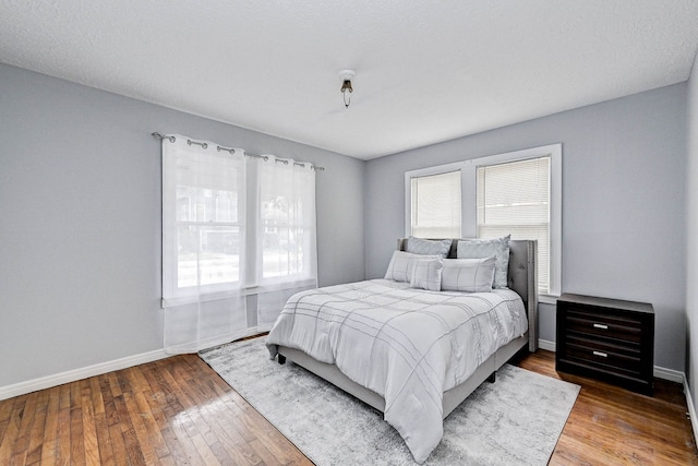 bedroom with wood-type flooring