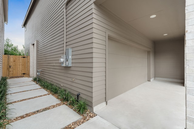 view of side of property featuring a garage