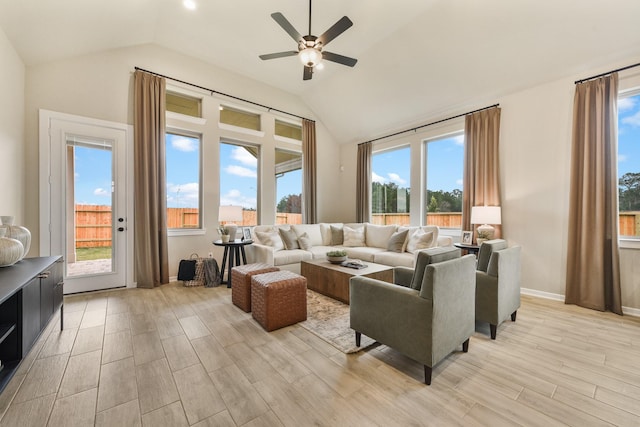 living room with vaulted ceiling, plenty of natural light, and ceiling fan