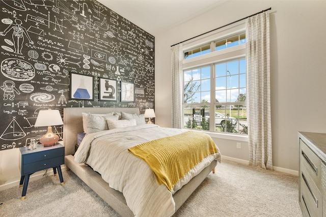 bedroom featuring light colored carpet