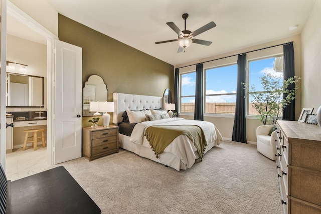 bedroom with ceiling fan and light colored carpet