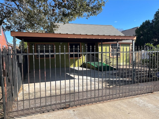 view of gate featuring a yard