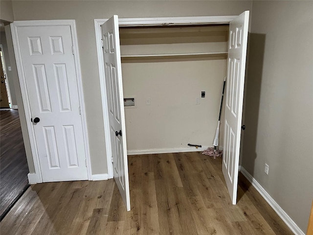 laundry area featuring washer hookup, hardwood / wood-style floors, and electric dryer hookup