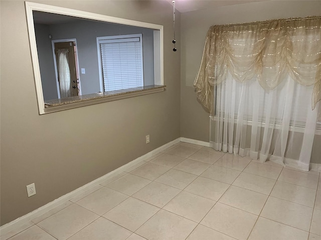 view of tiled spare room