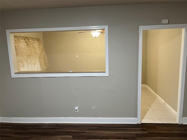 empty room with tile patterned flooring and ceiling fan